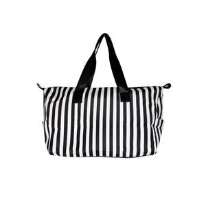 Alice and Olive striped duffle bag in black and white